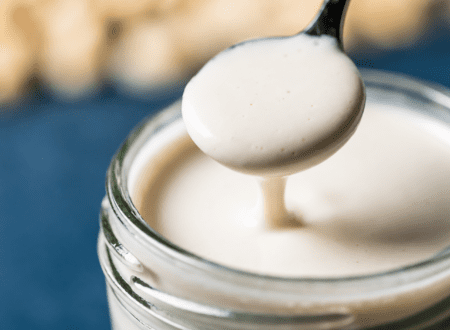Dairy free heavy cream substitute made with cashews and plant milk in a glass jar