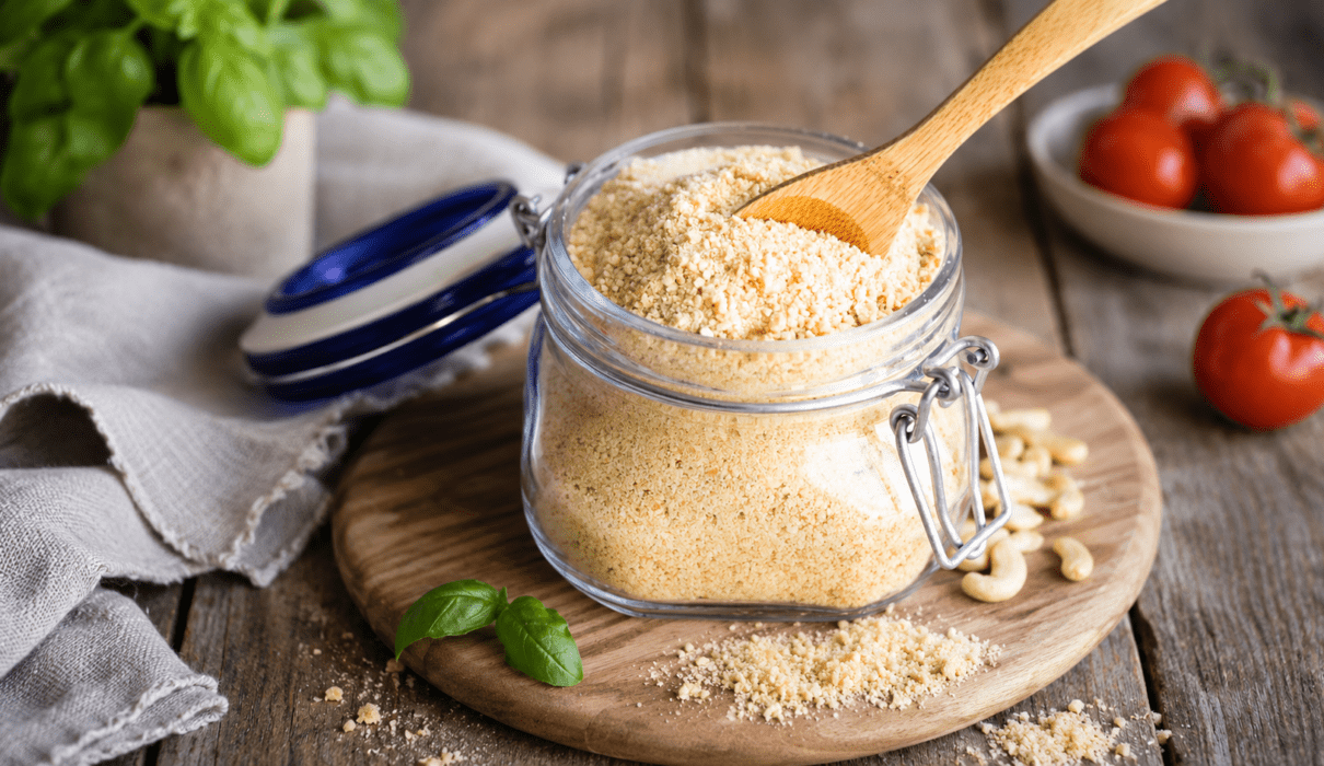 Homemade vegan Parmesan cheese substitute in a bowl made with cashews and nutritional yeast.