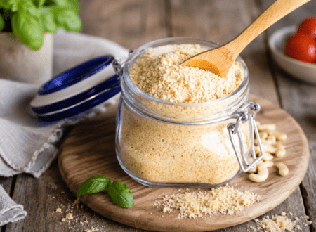 Homemade vegan Parmesan cheese substitute in a bowl made with cashews and nutritional yeast.