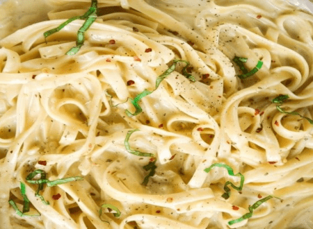 Assortment of vegan pasta sauces served with different pasta dishes on a table.