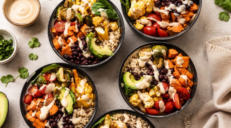 Seven healthy vegan meals featuring tofu, lentils, beans, chickpeas, vegetables, and whole grains.